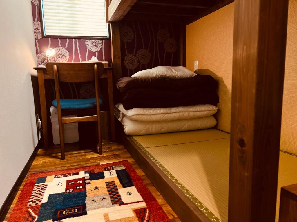 Letto o letti in una camera di 女性専用貸切の宿 月舟庵 Private female-only accommodation Tsukifunean