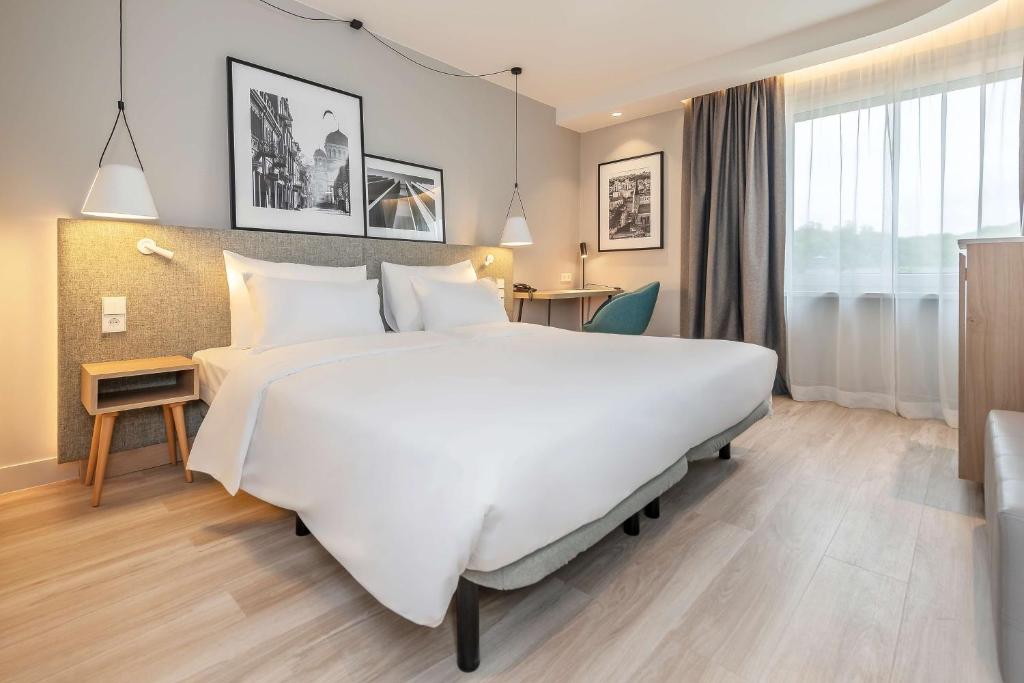 Postel nebo postele na pokoji v ubytování Radisson Hotel Kaunas