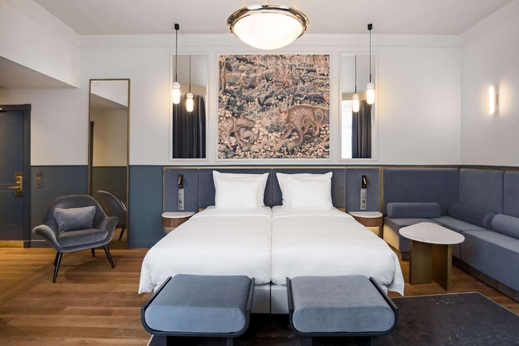 Postel nebo postele na pokoji v ubytování Radisson Collection Astorija Hotel, Vilnius