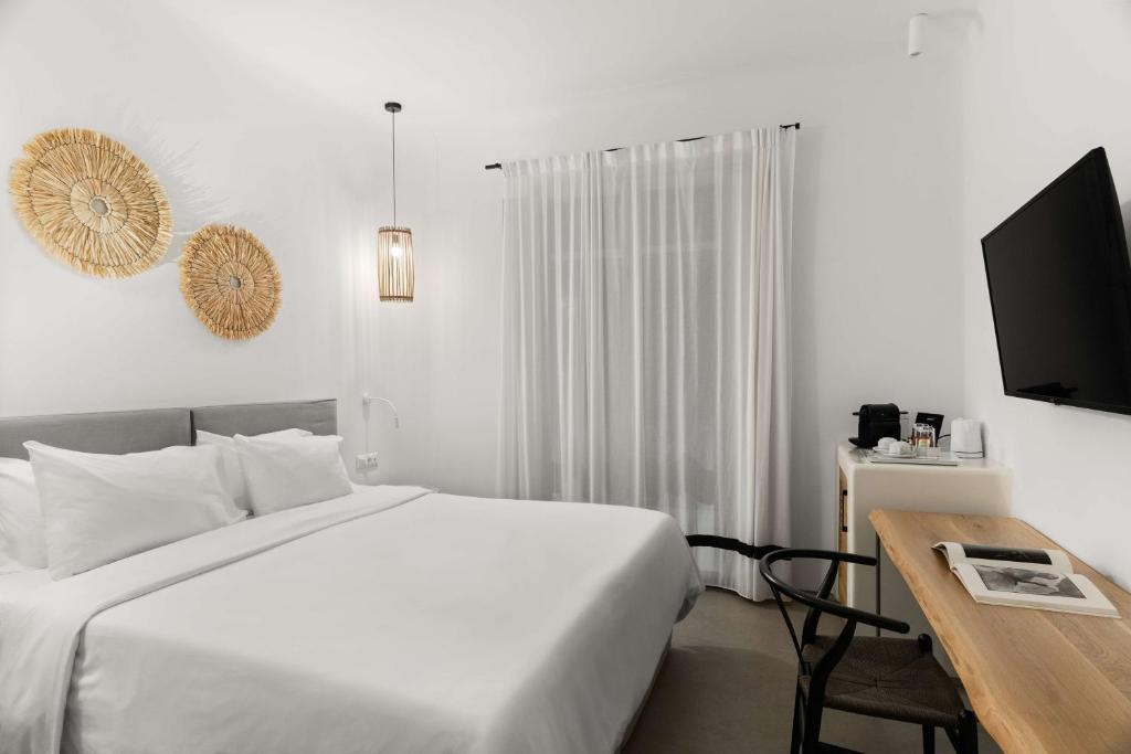 Postel nebo postele na pokoji v ubytování Radisson Blu Euphoria Resort, Mykonos