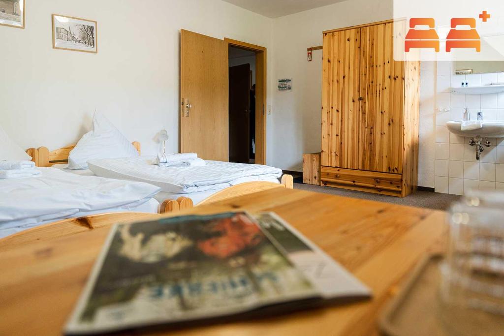 Postel nebo postele na pokoji v ubytování Pension Zum Hexenstieg