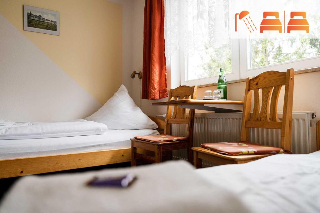 Postel nebo postele na pokoji v ubytování Pension Zum Hexenstieg