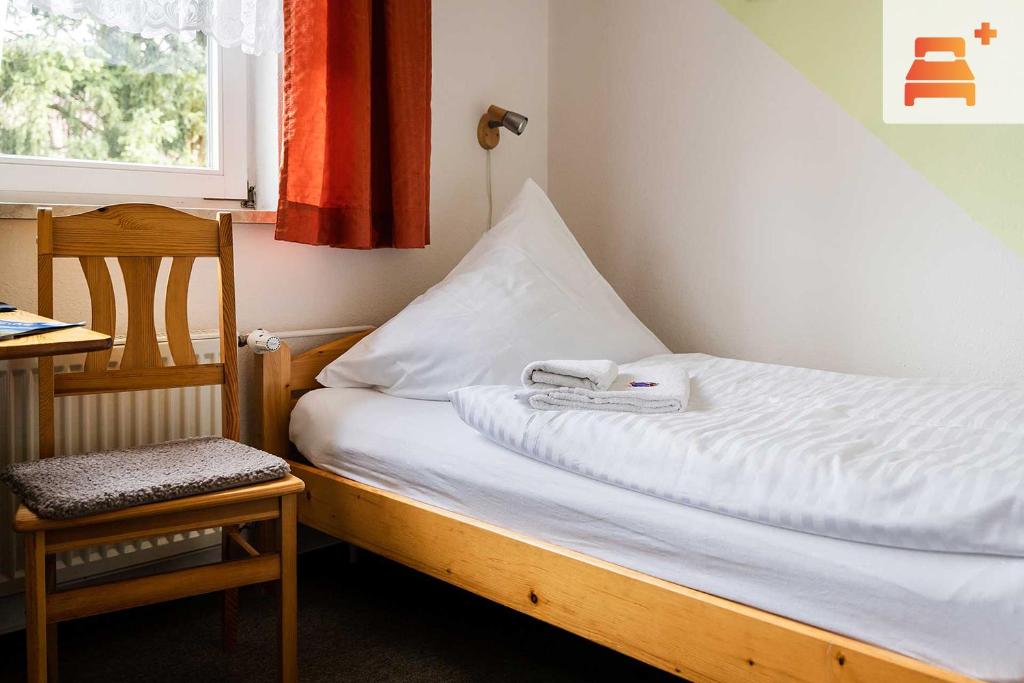 Postel nebo postele na pokoji v ubytování Pension Zum Hexenstieg