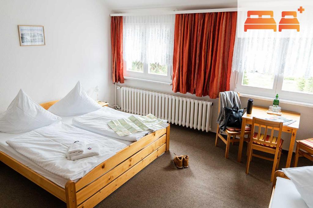 Postel nebo postele na pokoji v ubytování Pension Zum Hexenstieg