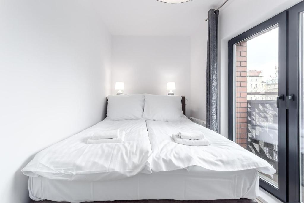 Posteľ alebo postele v izbe v ubytovaní Rent like home - Dwie Motławy III z parkingiem