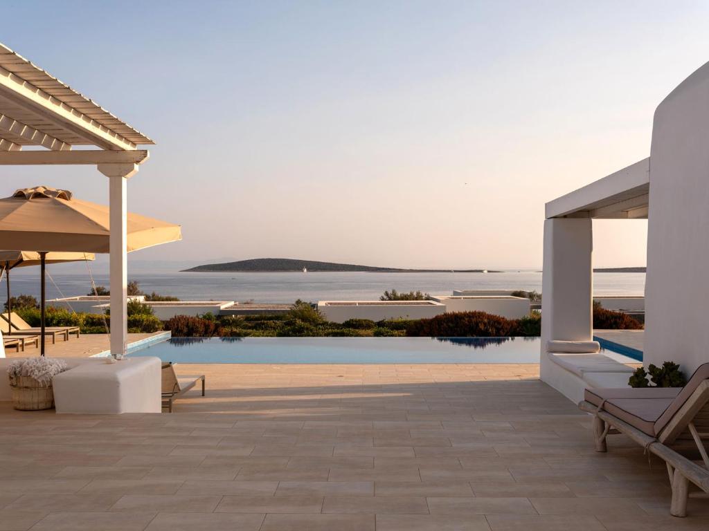 a patio of a villa with a view of the ocean at Bright Blue Villas-Villa Malinda in Aliki