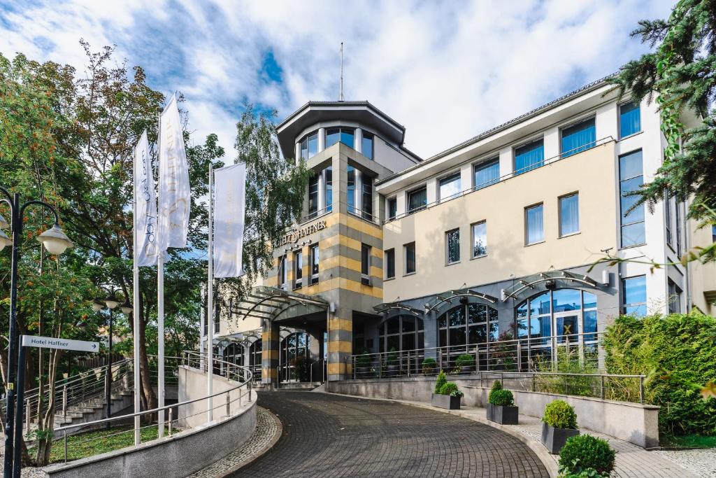 a building with a curved road in front of it at Haffner Hotel & SPA Sopot - Destigo Hotels in Sopot