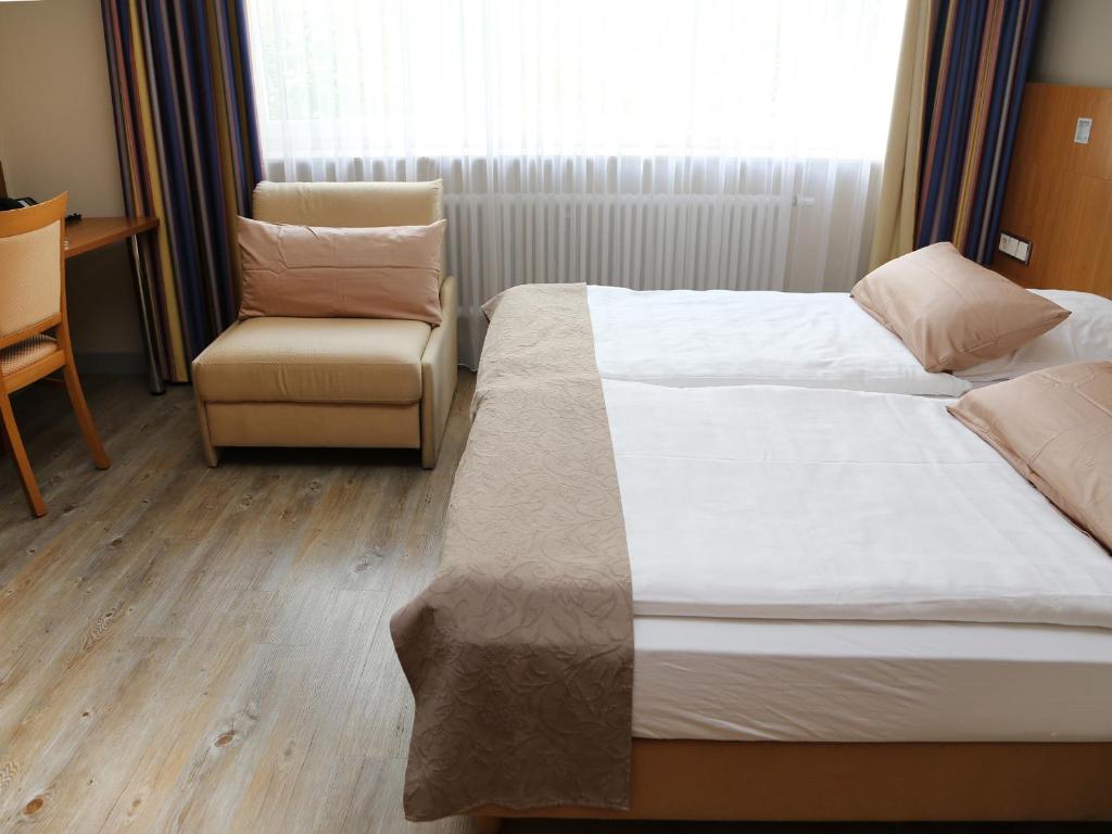 Postel nebo postele na pokoji v ubytování Hotel Lindleinsmühle
