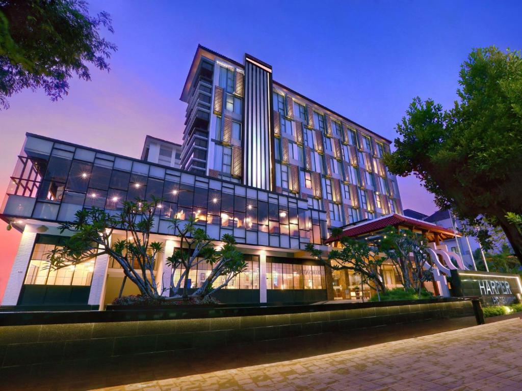 a large building with a lot of windows at night at Harper Malioboro Yogyakarta by ASTON in Yogyakarta