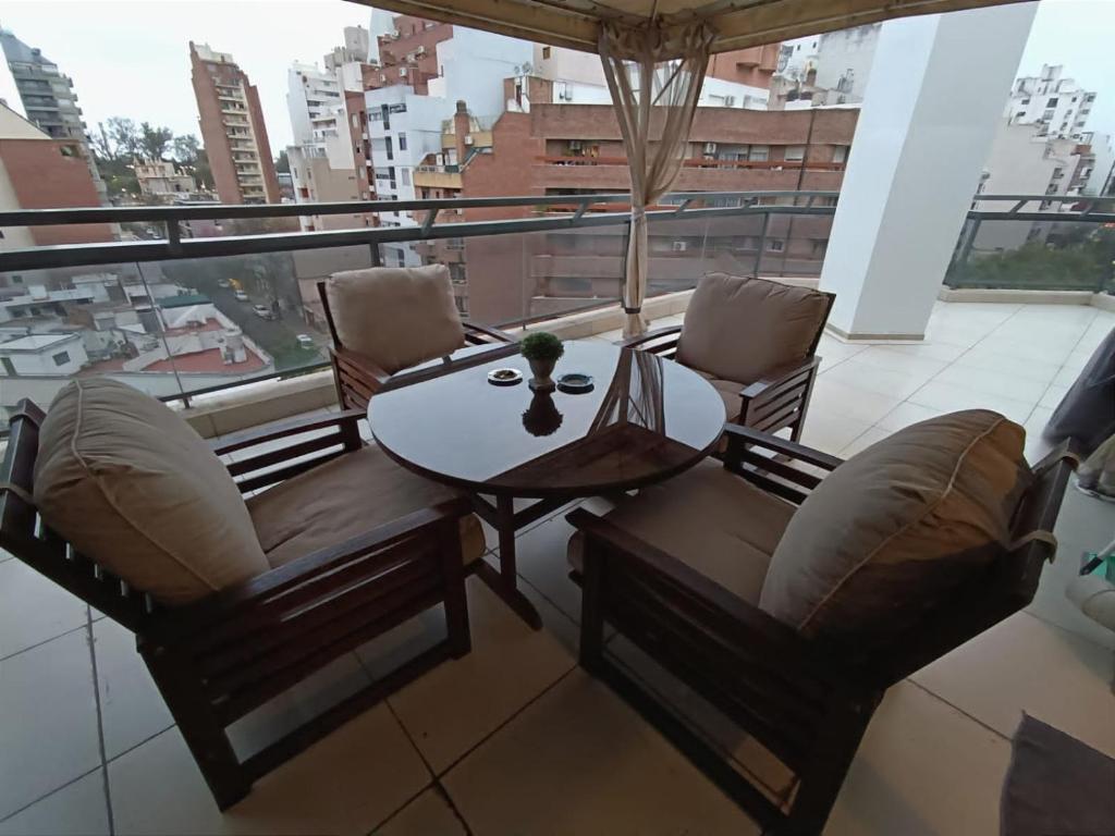 a room with a table and chairs and a balcony at ESPACIO C CRISOL Plaza España in Cordoba