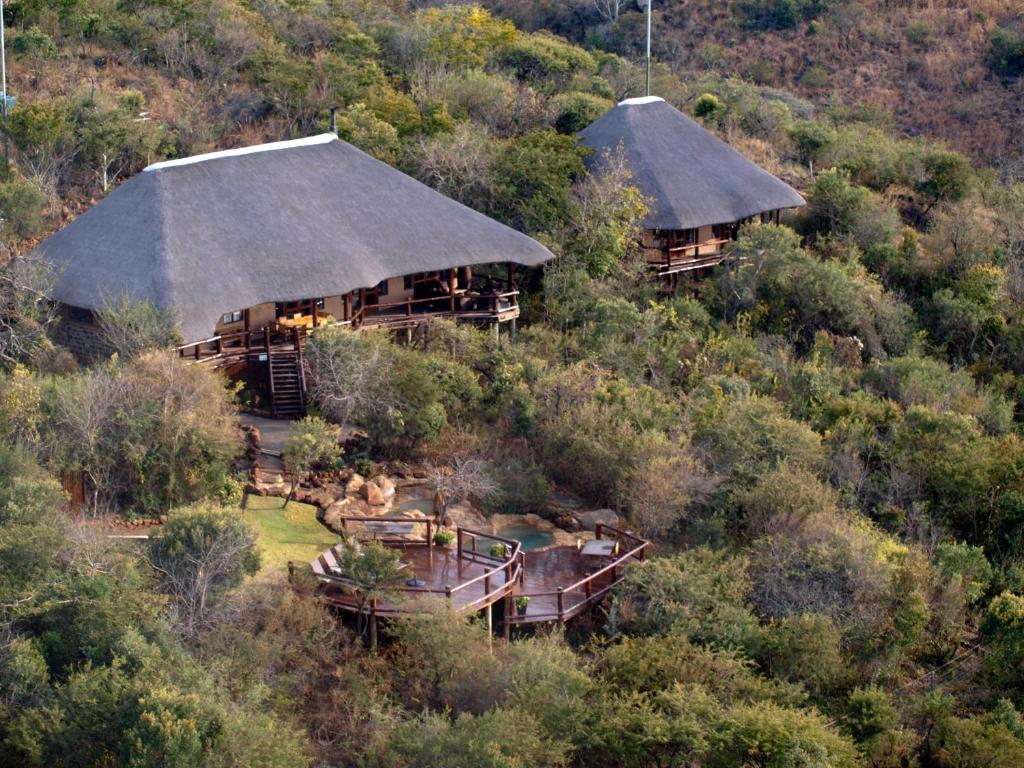 an aerial view of two houses on a hill at Elephant Rock Private Safari Lodge in Ladysmith