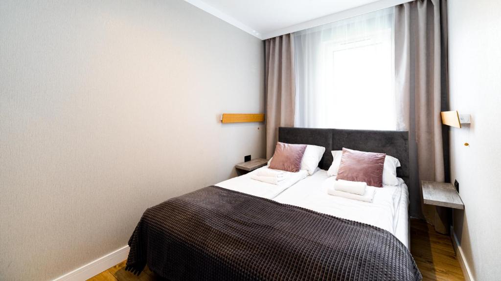 Postel nebo postele na pokoji v ubytování Wonder Home - Apartamenty blisko centrum, tuż przy kolei gondolowej i trasach Single Track