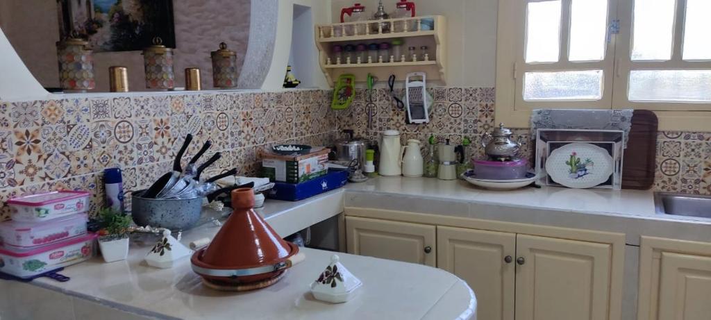 a kitchen with a counter top with a counter top at Villa in Marrakesh