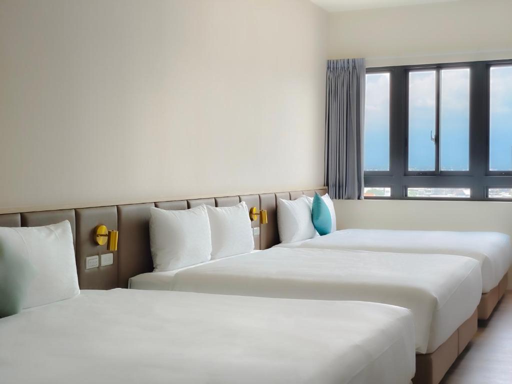 Postel nebo postele na pokoji v ubytování Hotel Sandao