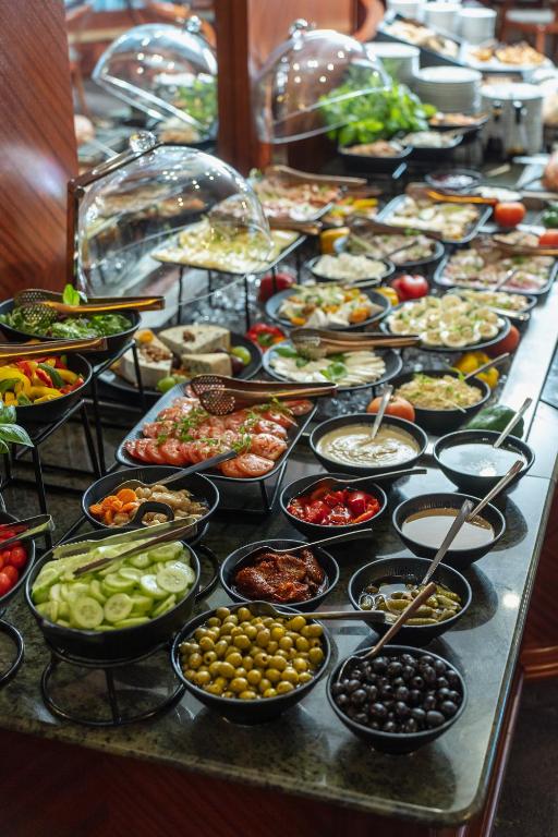 a buffet line with many different types of food at Haffner Hotel & SPA Sopot - Destigo Hotels in Sopot