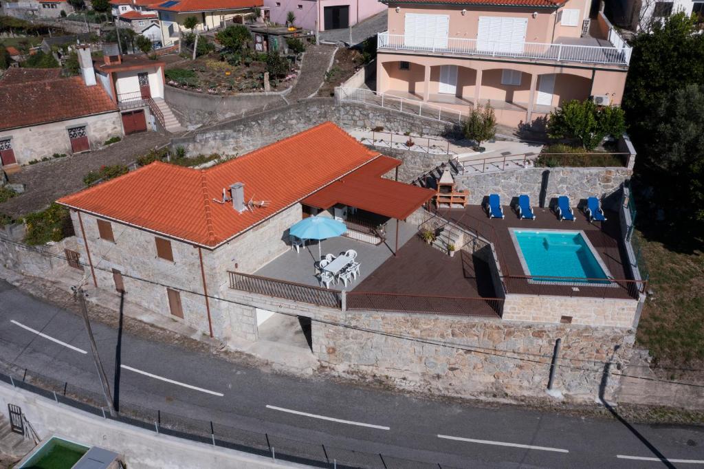 an aerial view of a house with a swimming pool at Emily's House in Arcos de Valdevez