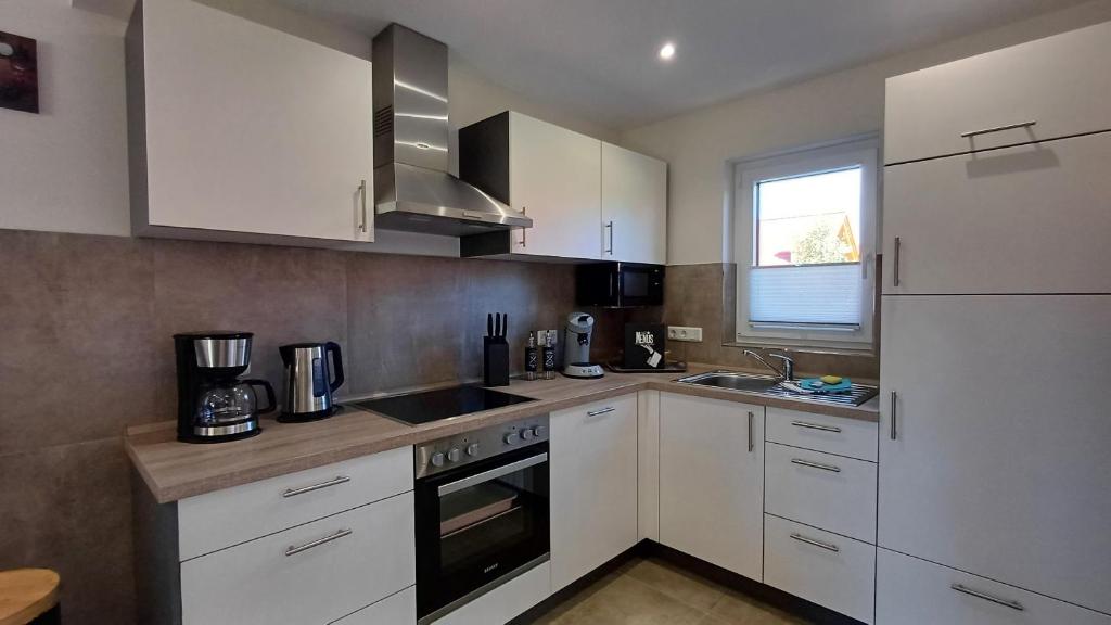 Kuchyň nebo kuchyňský kout v ubytování Premiumhaus DeLuchs