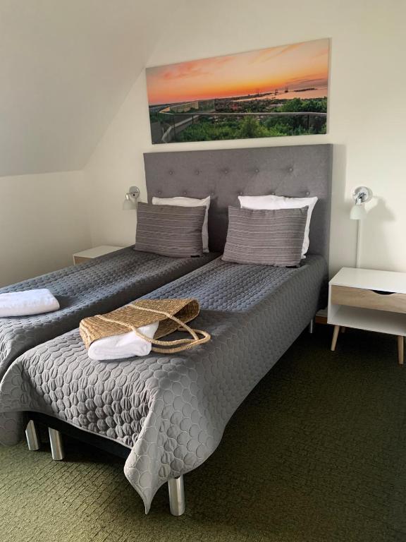 Postel nebo postele na pokoji v ubytování Svalereden Strand Camping Rooms