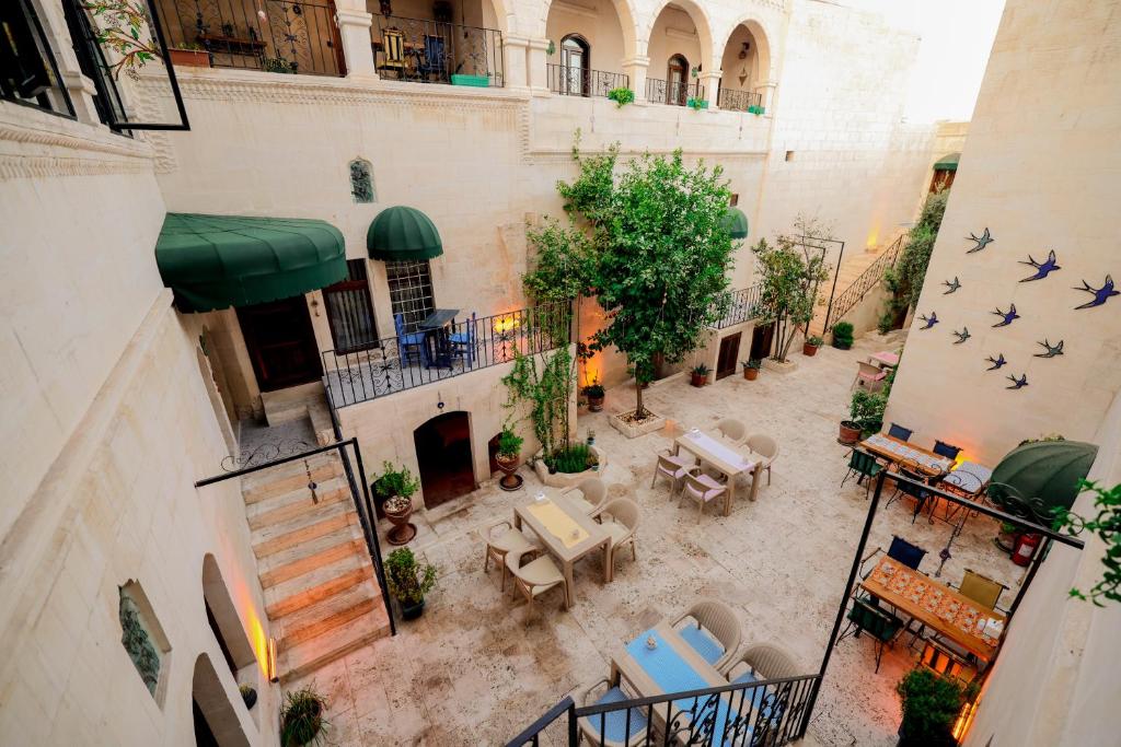 an overhead view of a courtyard with tables and chairs at ASTARTE HOTEL in Urfa