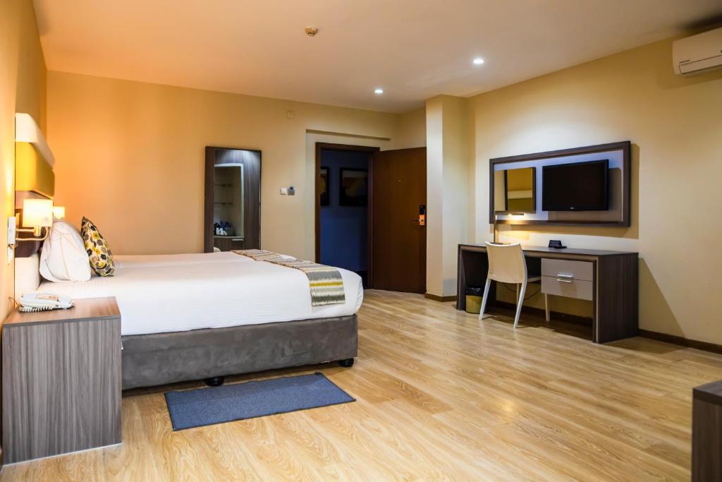 Postel nebo postele na pokoji v ubytování Hotel Maputo lda