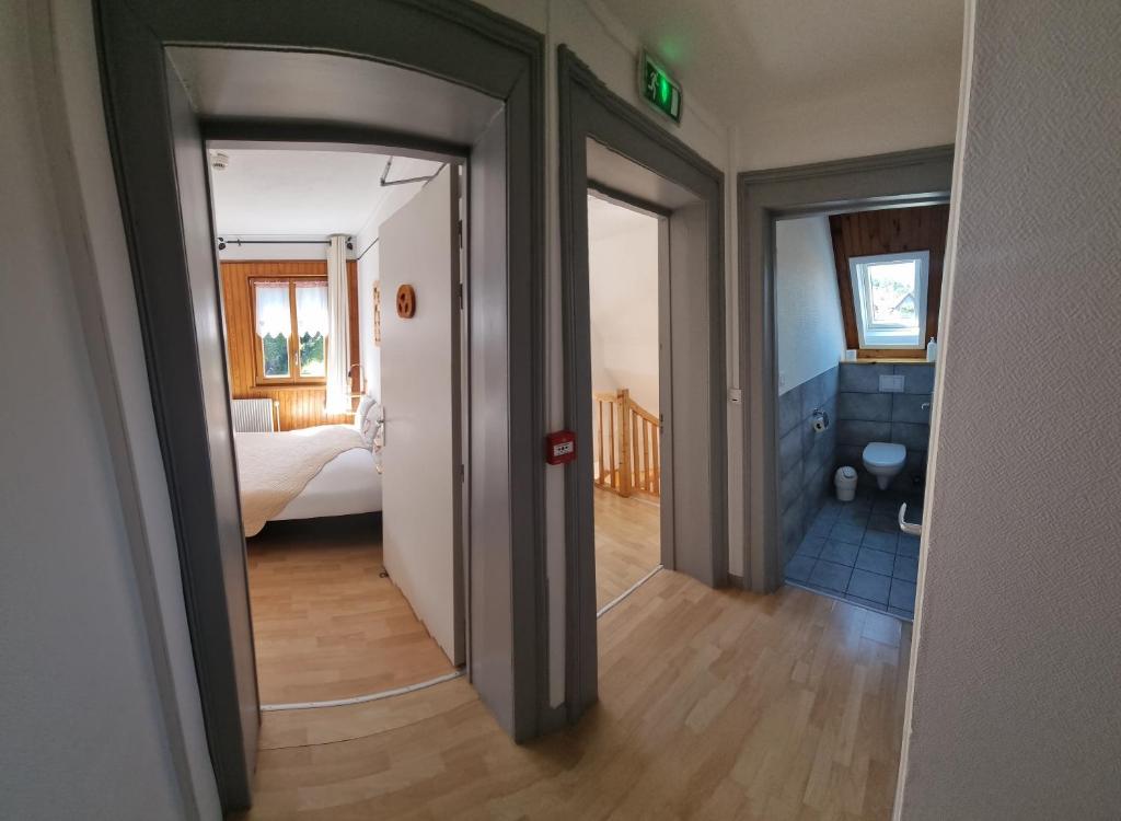 Postel nebo postele na pokoji v ubytování Chambres d'hôtes A la Fecht Nature et Bien-être