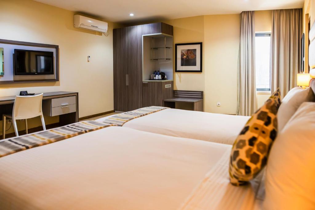Postel nebo postele na pokoji v ubytování Hotel Maputo lda