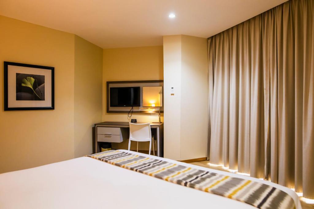 Postel nebo postele na pokoji v ubytování Hotel Maputo lda