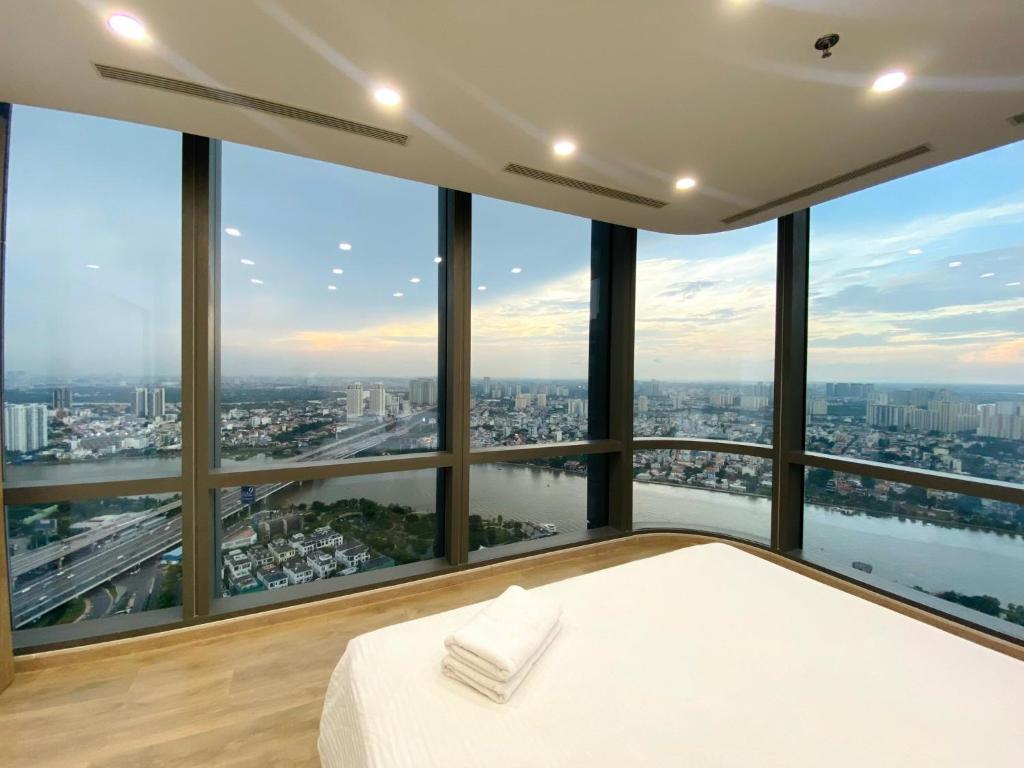 Giường trong phòng chung tại Landmark 81 - AirBnb
