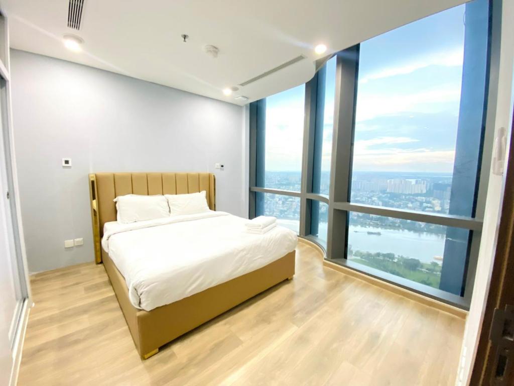 Giường trong phòng chung tại Landmark 81 - AirBnb