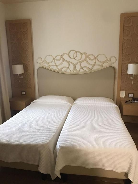 Postel nebo postele na pokoji v ubytování Hotel Duchessa Della Sila