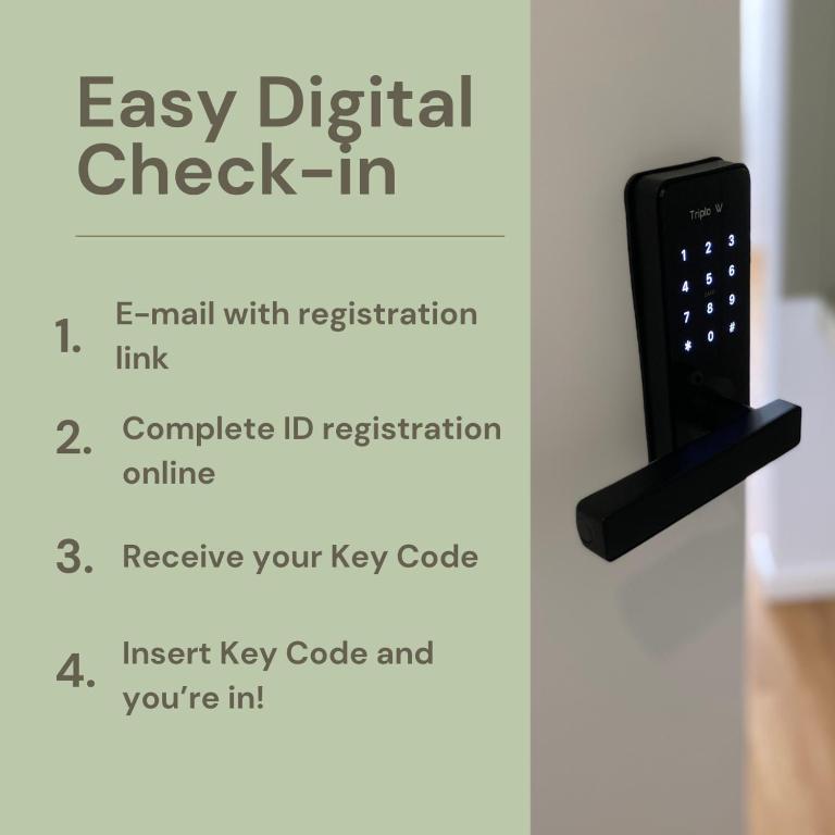 a remote control on a door with the text easy digital check in at Olive Boutique Guesthouse in Vila Franca do Campo
