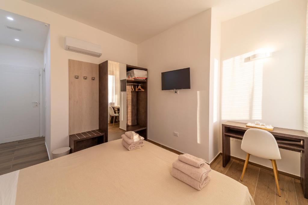 TV a/nebo společenská místnost v ubytování Mentana Rooms