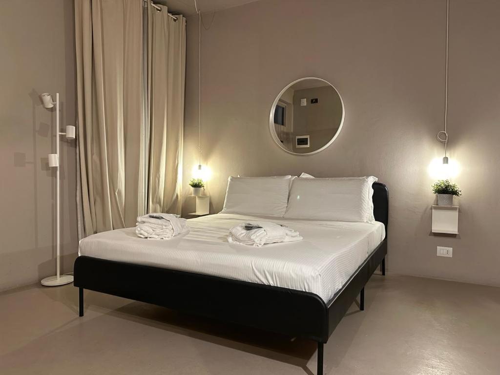 Posteľ alebo postele v izbe v ubytovaní Welc-ōm Santa Giustina apartment