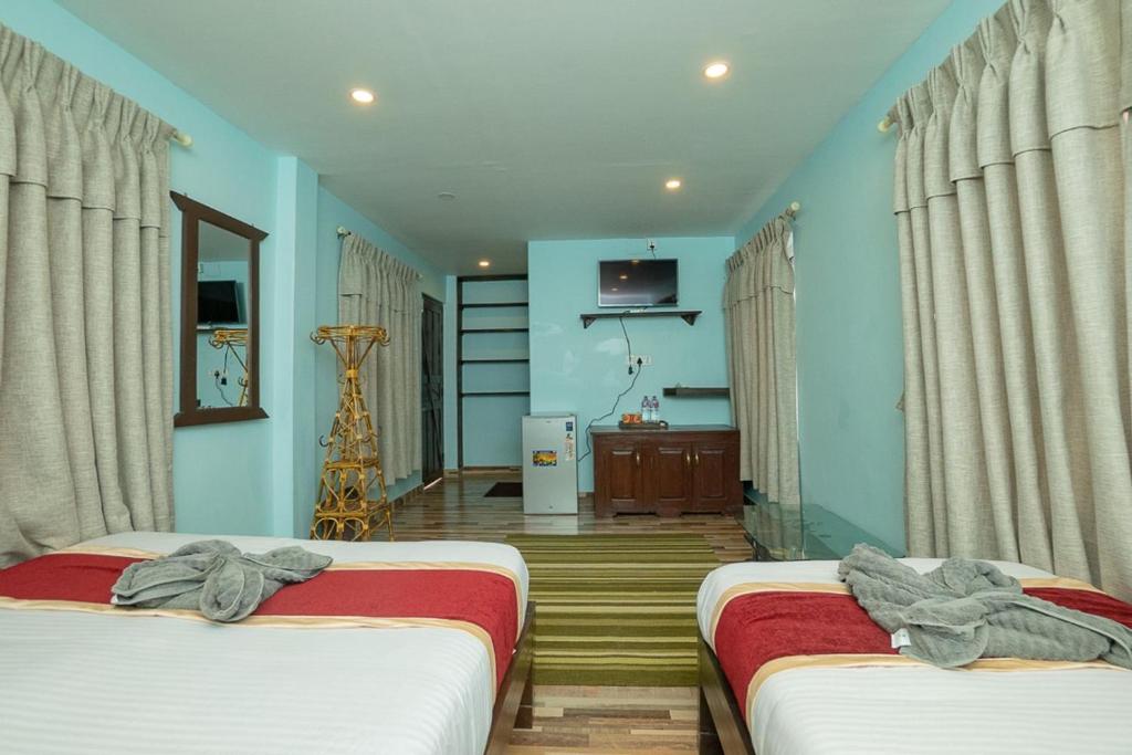 Postel nebo postele na pokoji v ubytování Naman Boutique Home