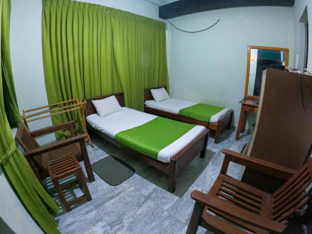 Postel nebo postele na pokoji v ubytování Samara Guest inn