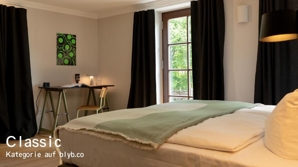 Postel nebo postele na pokoji v ubytování Blyb Hotel