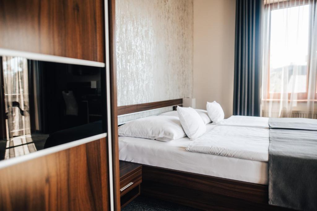 Postel nebo postele na pokoji v ubytování Hotel Elegance