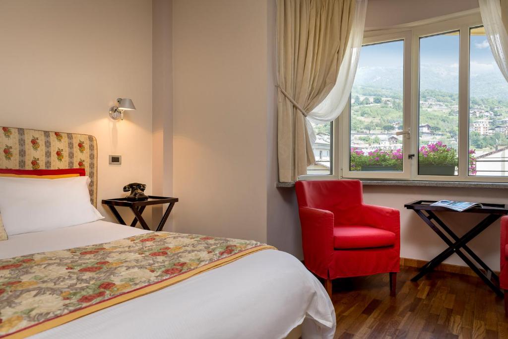 Postel nebo postele na pokoji v ubytování Bijou Hotel