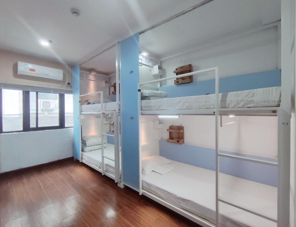 Postel nebo postele na pokoji v ubytování Onederz Hostel Hangzhou