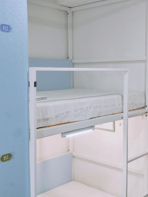 Palanda nebo palandy na pokoji v ubytování Onederz Hostel Hangzhou