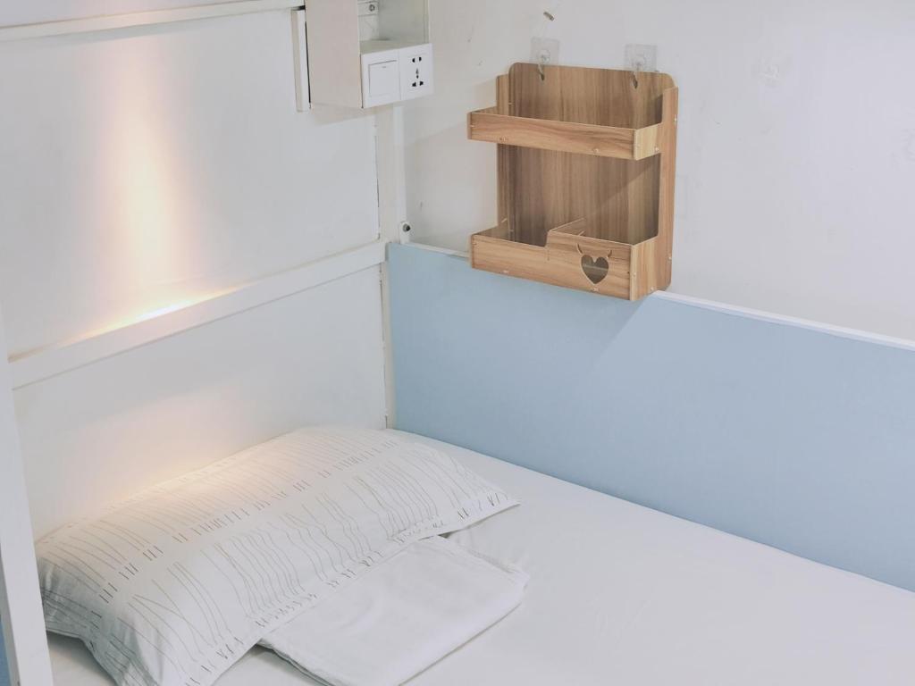 Postel nebo postele na pokoji v ubytování Onederz Hostel Hangzhou