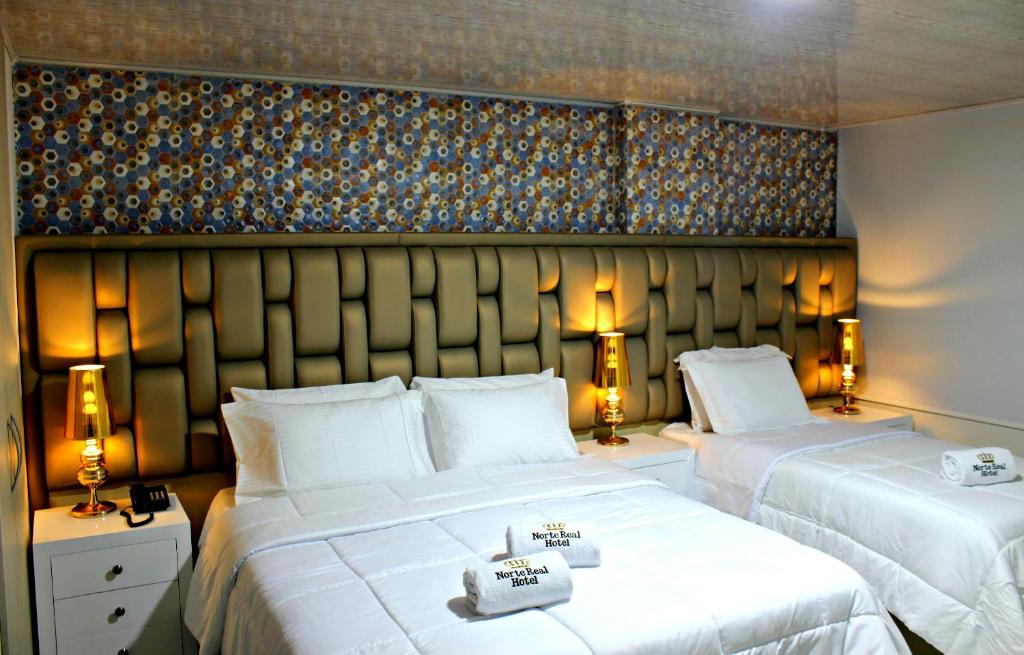 Ένα ή περισσότερα κρεβάτια σε δωμάτιο στο NORTE REAL HOTEL