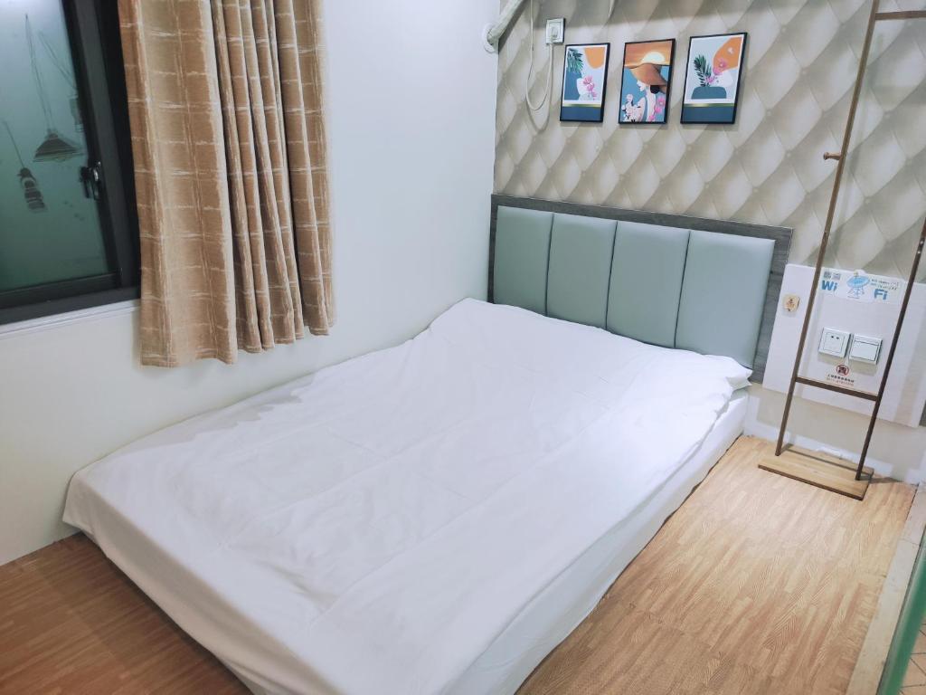 Postel nebo postele na pokoji v ubytování Onederz Hostel Hangzhou
