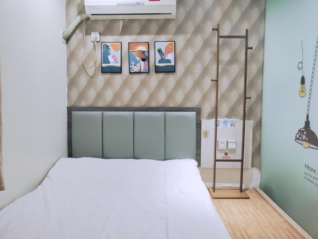 Postel nebo postele na pokoji v ubytování Onederz Hostel Hangzhou