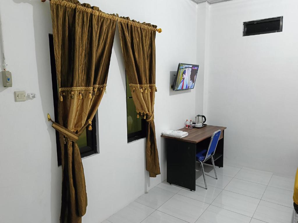 TV a/nebo společenská místnost v ubytování Solo Nadamax City Guest House Syariah