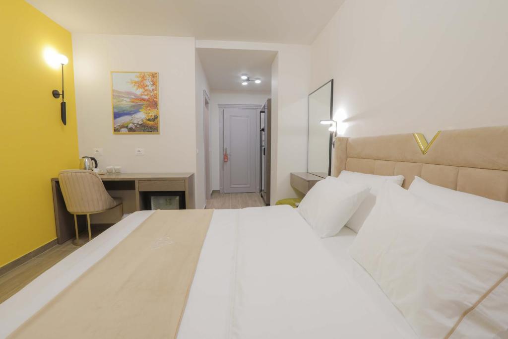 Postel nebo postele na pokoji v ubytování Olia Residence