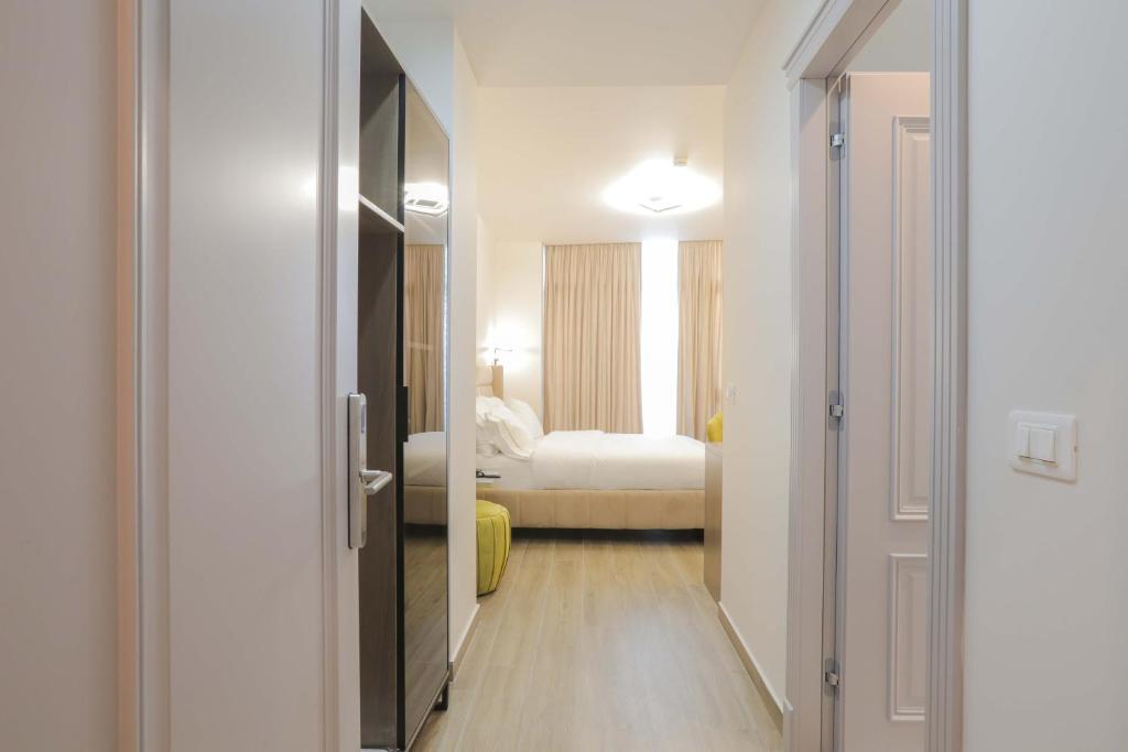 Postel nebo postele na pokoji v ubytování Olia Residence