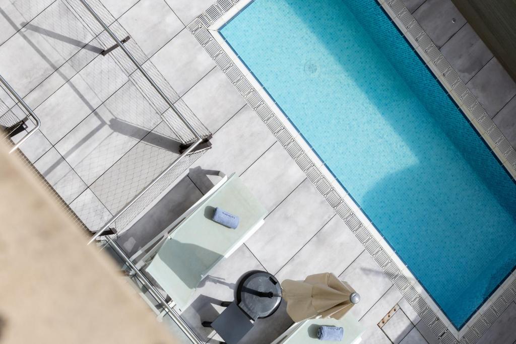 an overhead view of a swimming pool in a building at Catalonia Diagonal Centro in Barcelona