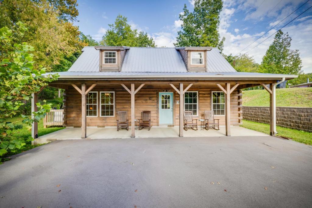 a log cabin with a metal roof at Paws in the Air in Pigeon Forge