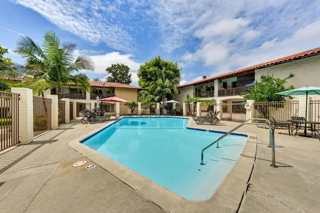 a swimming pool in front of a building at San Diego Condo Pool Access, 8 Mi to Downtown in San Diego